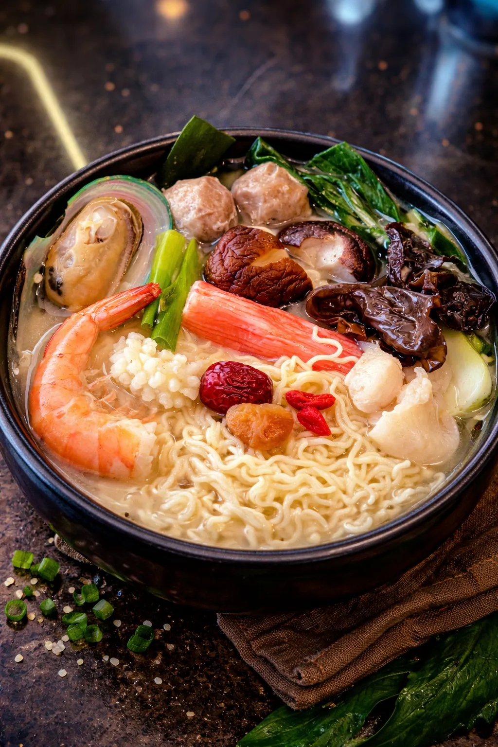 Mild creamy seafood noodle soup with herbal ingredients at FirePot Korean BBQ & Hot Pot, an Asian Restaurant in Grand Forks