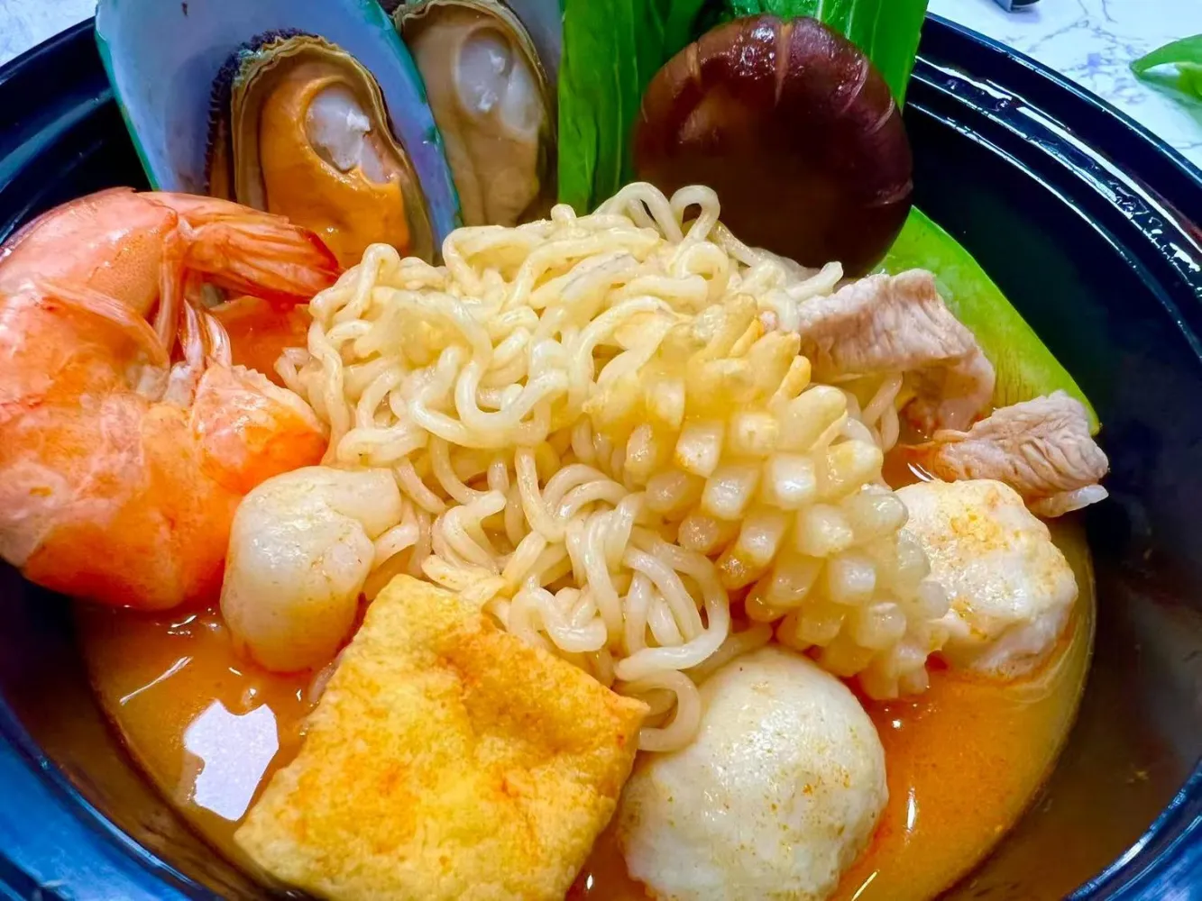 Seafood noodle pot with mixed seafood and fried tofu at FirePot Korean BBQ & Hot Pot, an Asian Restaurant in Grand Forks